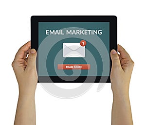 Hands holding tablet with email marketing concept on screen