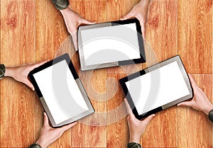 Hands Holding Three Digital Tablet Computers