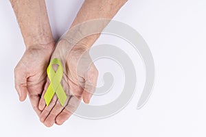 Hands holding .turquoise or teal ribbon. White background photo