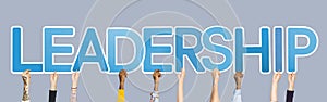 Hands holding up blue letters forming the word leadership photo