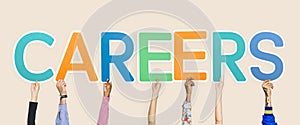 Hands holding up colorful letters forming the word careers photo