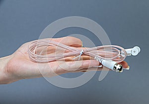 Hands holding various converter cables adapters for computers and smartphones
