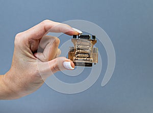 Hands holding various converter cables adapters for computers and smartphones