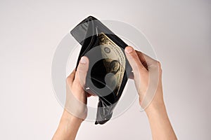 Hands holding wallet with coins money on white background