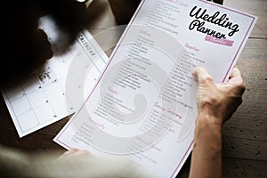 Hands Holding Wedding Planner Checklist Information Preparation