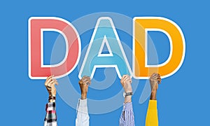 Hands holding the word dad