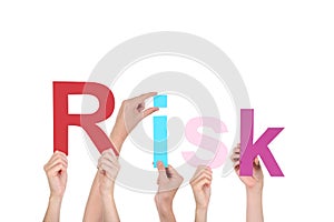 Hands holding the word Risk