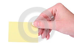 Hands holding a yellow blank notecard