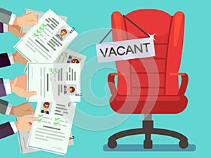 Hands holds CV forms and office chair with vacancy plate