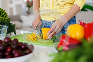 The hands of Housewives during cooking salad