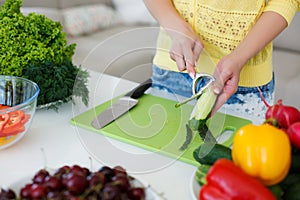 The hands of Housewives during cooking salad