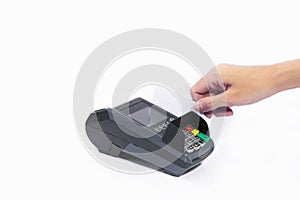 Hands insert blank white credit card into card machine isolated