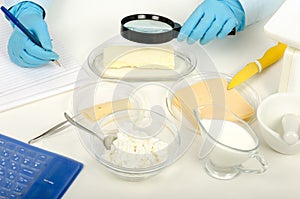 Hands inspecting butter in phytocontrol laboratory