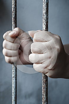 hands of jail holding photo
