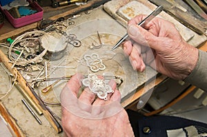 Hands of jeweller