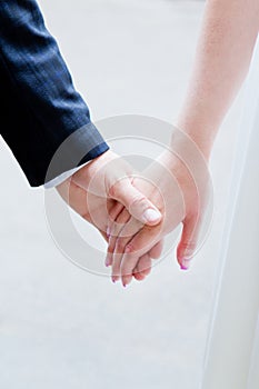 Hands of justmarried couple