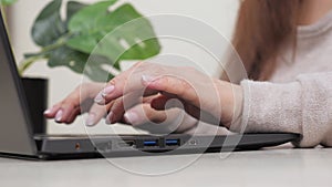 Hands on keyboard. Freelancer is a busy worker working with a modern portable device. Business woman, working on laptop