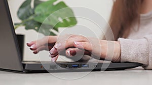 Hands on keyboard. Freelancer is a busy worker working with a modern portable device. Business woman, working on laptop