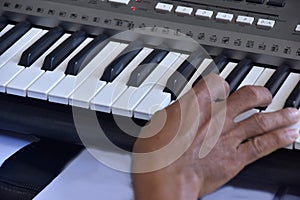 Hands of a keybord player during a live performance photo