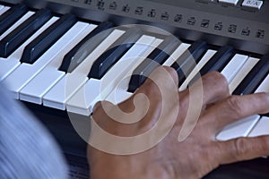 Hands of a keybord player during a live performance photo