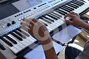 Hands of a keybord player during a live performance photo
