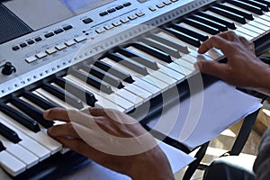 Hands of a keybord player during a live performance photo