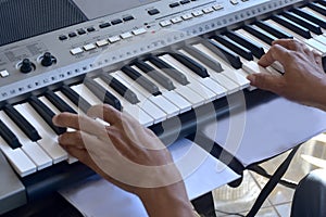 Hands of a keybord player during a live performance photo