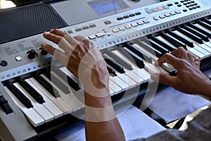 Hands of a keybord player during a live performance photo