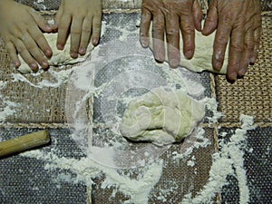 Hands kneading bread dough