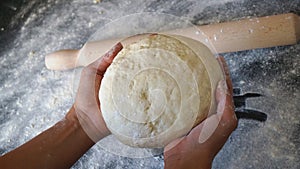 Hands kneading bread dough