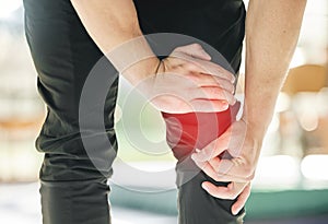 Hands, knee pain and injury in gym after accident, workout or training exercise for sports. Health, fitness and athlete