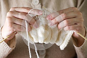 Hands knitting cose-up