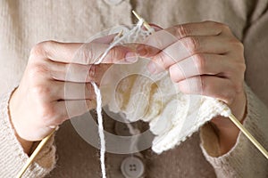 Hands knitting cose-up