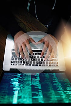 Hands, laptop and overhead with a man programmer coding while typing on a keyboard for software development. Computer