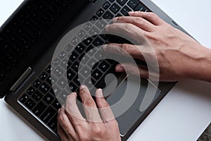 Hands with laptop typing