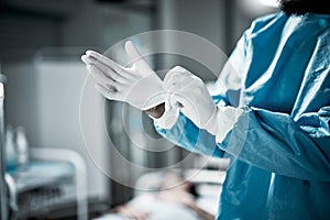 Hands, latex gloves and surgeon preparing for operation in a consultation room in the hospital. Healthcare, surgical and