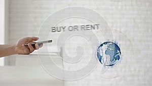 Hands launch the Earth`s hologram and Buy or rent text