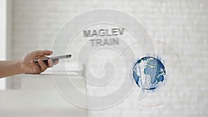 Hands launch the Earth`s hologram and Maglev train text