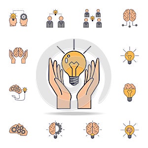 hands and a light bulb fild color icon. Detailed set of color idea icons. Premium graphic design. One of the collection icons for
