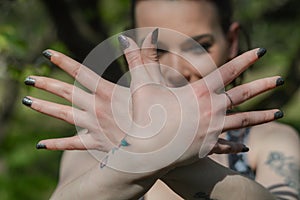 Hands like a bird Sign. Young woman crossing hands forming a flying bird symbol gesture.