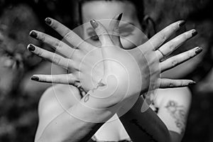 Hands like a bird Sign. Young woman crossing hands forming a flying bird symbol gesture.