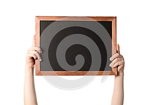 The hands of a little boy holding a frame with a blank dark background for text. isolated on white background