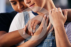 Hands, love and lgbt with a woman couple hugging outdoor for romance, dating or non binary affection. Hug, date and gay