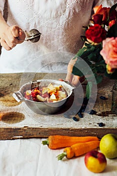 Hands makes strawberry smoothies in wooden table . Fresh strawbe