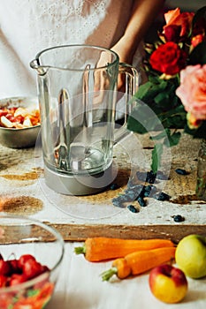 Hands makes strawberry smoothies in wooden table . Fresh strawberry smoothies fruit. Recipe carrot-strawberry smoothie. Action. R