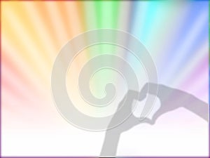 Hands making love heart shadow on rainbow ray sunburst style abstract background.