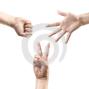 Hands making: Rock, paper, scissors