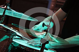 Hands of a male musician playing drums