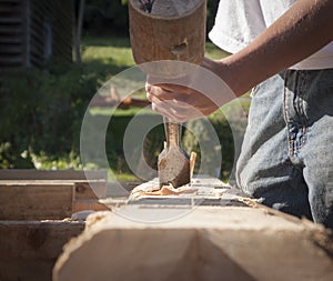 Hands with Mallet and Chisel Hollowing Out Mortise