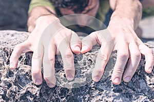 Hands of Man Climbing